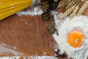 Baking cake. Eggs, flour, wheat on vintage wood table