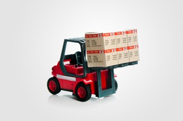 Forklift truck toys with boxes. Concept of international freight