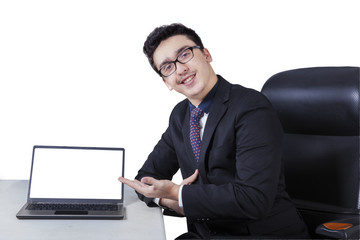 Caucasian man with empty laptop screen