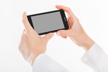 female hand is holding a modern touch screen phone. Screen is cu