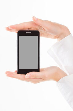 female hand is holding a modern touch screen phone. Screen is cu