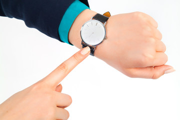 business woman pointing her watch over white background
