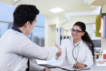 Friendly doctor with male patient