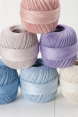 Set Of Cotton Crocheting Thread Bobbins on Wooden Table