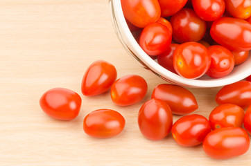 Fresh tomatoes on wooden background