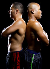 black boxer posing with latino opponent on a black background