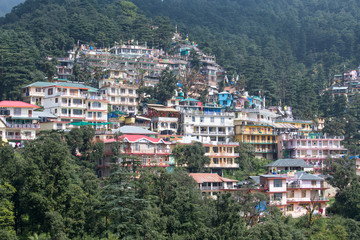 Fototapeta na wymiar Houses at Himalaya mountains in Dharamshala, India