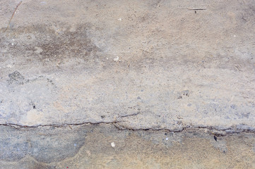 The old grey concrete wall crack background