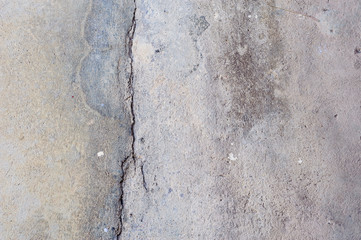 The old grey concrete wall crack background