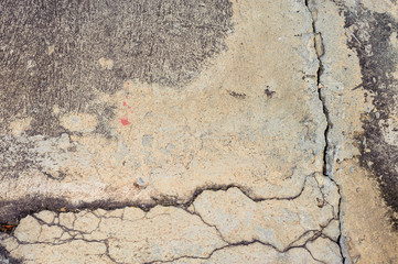 Obraz premium The old grey concrete wall crack background