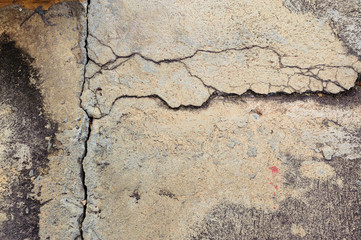 The old grey concrete wall crack background