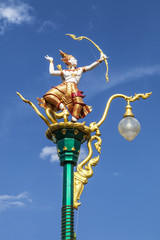 Fototapeta na wymiar Street lighting art, lamp hanger, Thai angel archery