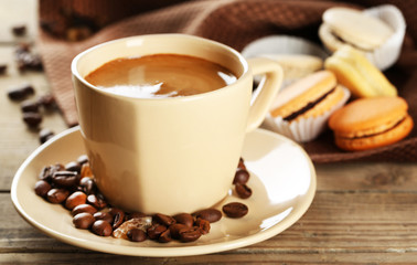 Gentle colorful macaroons and  coffee in mug