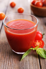 Tomato juice in glass with basil  and tomatoes cherry