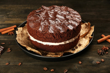 Delicious chocolate cake on table close-up