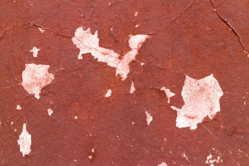 Fototapeta premium Crack red painted wall texture background.