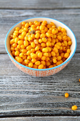 Seabuckthorn acid in a bowl on boards