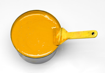 Close up Yellow Ink in a Can with Brush