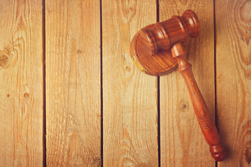 Judge gavel on wooden vintage background
