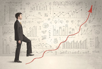 Business man climbing on red graph arrow concept