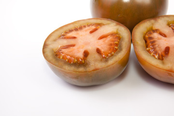 Whole and sliced kumato tomatoes