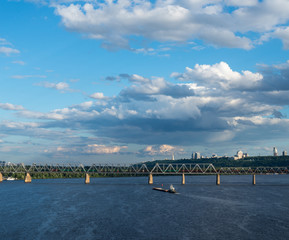 The barge floating in the blue Dnieper waters