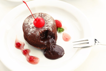 Hot chocolate pudding with fondant centre on plate, close-up