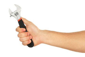 Adjustable wrench in male hand isolated on white