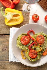 Tasty pasta with pepper, carrot and tomatoes