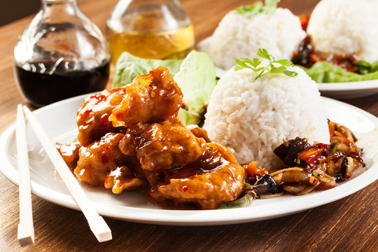 Fried chicken pieces with sweet and sour sauce