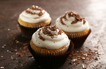 Delicious cupcakes on table close-up