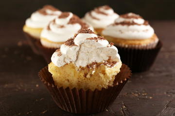 Delicious cupcakes on table close-up