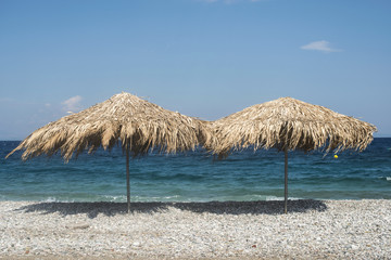 Straw umbrellas on the beach