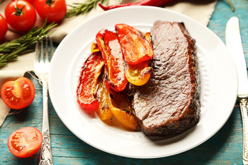 Composition with tasty roasted meat  and vegetables