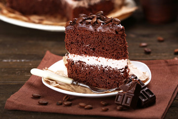 Delicious chocolate cake on table close-up