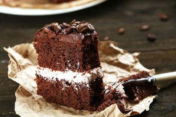 Delicious chocolate cake on table close-up
