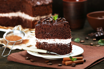 Delicious chocolate cake on table close-up