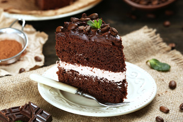 Delicious chocolate cake on table close-up