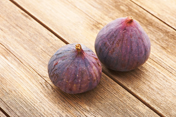 Fresh figs on wooden table