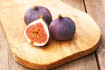 Fresh figs on wooden table