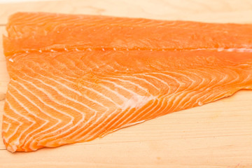 Fresh Atlantic Salmon on Wood Cutting Board
