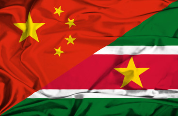 Waving flag of Suriname and China