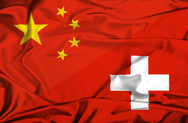 Waving flag of Switzerland and China