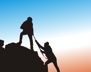 Silhouette of helping hand between two climber