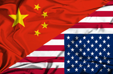 Waving flag of United States of America and China