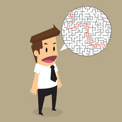 Businessman finding the solution of a maze