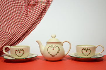 China tea set with a heart icon