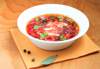 Plate of delicious borsch on the table