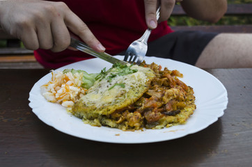 Outdoor potato pancake eating