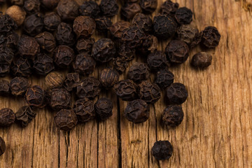 black pepper on wooden table